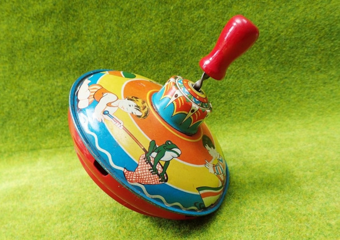 Juguete de peonza de hojalata de la década de 1950, Elbezet