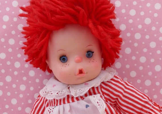 Doll with red store yarn hair