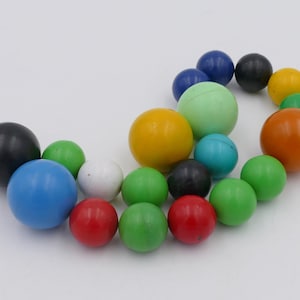 Collection of Twenty 1980&#39;s Clickets Magnetic Marbles Novelty Toys Collectibles