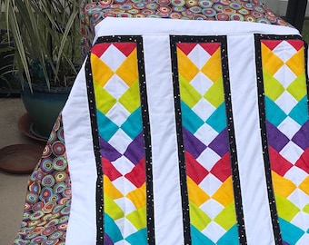 Beautiful handmade rainbow quilt throw.