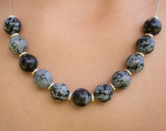 Snowflake Obsidian beaded necklace. With silver chain and silver beads.