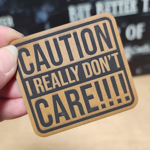 Laser Engraved Caution: I Don't Care Hat Patch, Leatherette