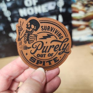 Surviving Purely Out Of Spite Trucker Hat Patch, Laser Engraved Leatherette
