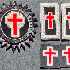 May include: A collection of religious emblems featuring red crosses. The set includes a large, circular emblem with a starburst design, two rectangular patches, and two square patches, all with a black background.