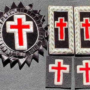 May include: A collection of religious emblems featuring red crosses on a black background. The set includes a circular emblem with a cross, two rectangular patches, and two square patches, all with silver trim.