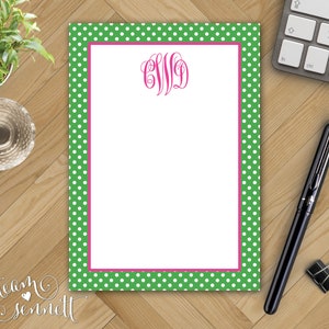 May include: Green notepad with white polka dots and a pink border. The notepad has a pink monogram in the center that says "CWD".