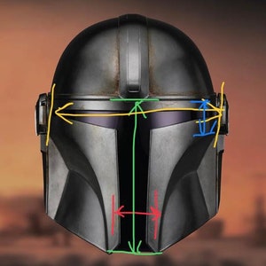 May include: A black and gray helmet with a visor and a textured surface. The helmet has a vertical line down the center and a horizontal line across the top.