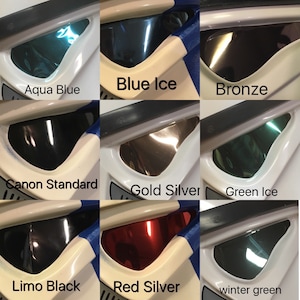 May include: A collage of nine images showing different colored visor options for a Stormtrooper helmet. The colors include aqua blue, blue ice, bronze, canon standard, gold silver, green ice, limo black, red silver, and winter green.