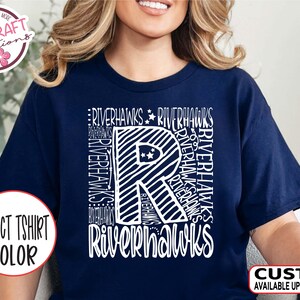 May include: Navy blue t-shirt with a white graphic of the letter "R" made up of the word "Riverhawks" repeated multiple times. The shirt is available in a variety of colors.