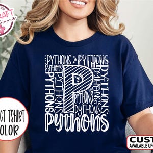 May include: Navy blue t-shirt with the word "Pythons" in a white, stylized design. The letter "P" is prominent, with the word repeated vertically. The shirt has the text "Select Tshirt Color" and "Custom Available Upon Request".