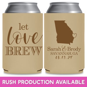 May include: Two brown and beige can coolers. The left cooler has the text 'let love BREW' in brown. The right cooler has a brown outline of the state of Georgia with a small heart in the bottom right corner. The text 'Sarah & Brody SAVANNAH, GA 08.13.24' is below the outline of Georgia.