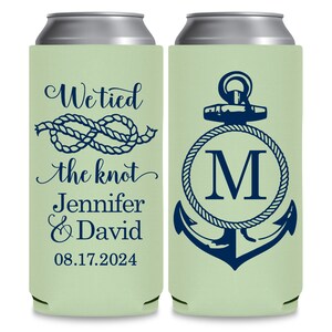 May include: Two green and white can coolers with a nautical theme. The left cooler has a rope knot design and the text 'We tied the knot Jennifer & David 08.17.2024'. The right cooler has an anchor with a rope design and the letter 'M' in a circle.