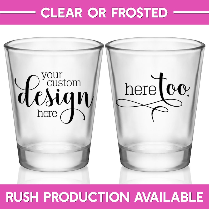 May include: Two clear shot glasses with black text. The first shot glass says 'your custom design here' and the second shot glass says 'here too.' The shot glasses are on a white background.