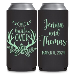 May include: Two black can coolers with a green design. The left cooler has a floral design with antlers and the text 'The hunt is over'. The right cooler has the text 'Jenna and Thomas March 8, 2024'.