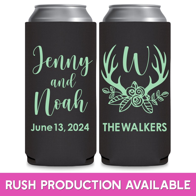 May include: Two black and white can coolers with a green design. The left cooler has the text 'Jenny and Noah June 13, 2024'. The right cooler has a floral design with antlers and the letter 'W' inside the antlers. The text 'THE WALKERS' is below the design.