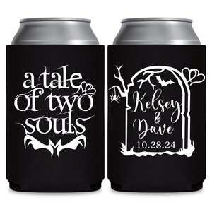 May include: Two black and white Halloween themed can coolers. One cooler says 'a tale of two souls' with a heart and bat design. The other cooler has a tombstone with the text 'Kelsey & Dave 10.28.24' and a bat and spider design.