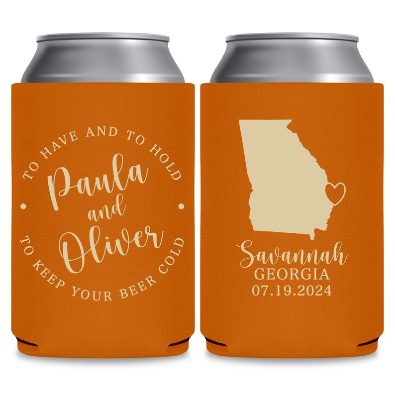 May include: Two orange can coolers with white text. The left cooler says 'To have and to hold Paula and Oliver to keep your beer cold.' The right cooler has a white outline of the state of Georgia with a heart in the middle. The text below the state says 'Savannah Georgia 07.19.2024.'