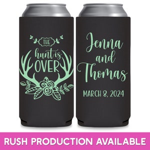 May include: Two black and green can coolers with a wedding theme. The left cooler has a floral design with antlers and the text 'The hunt is over'. The right cooler has the text 'Jenna and Thomas March 8, 2024'.
