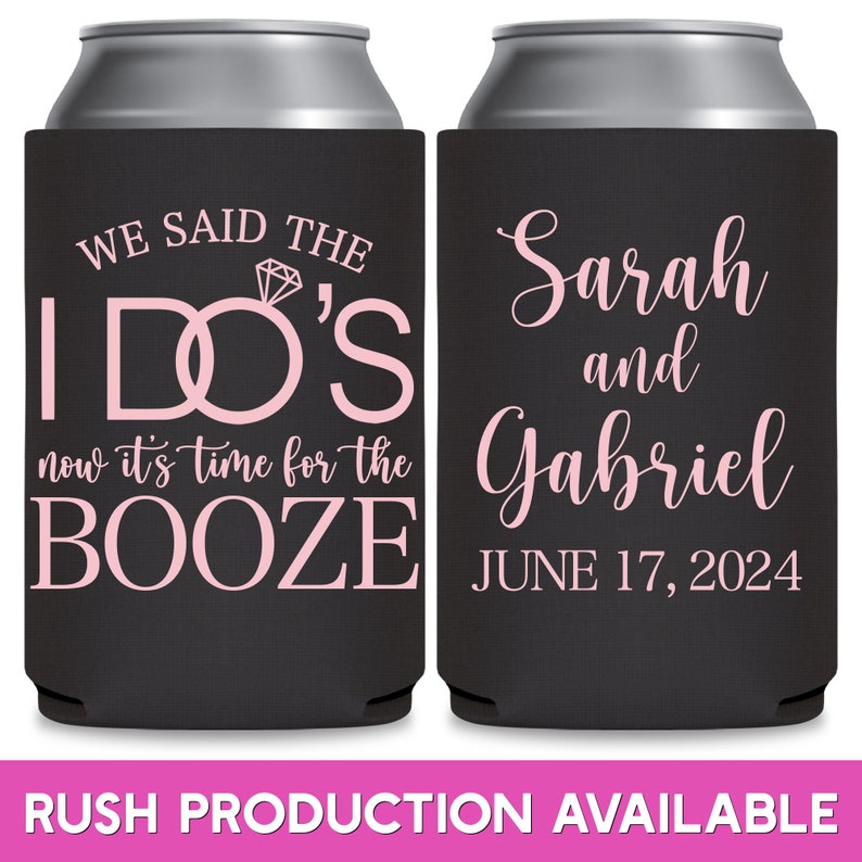 May include: Two black can coolers with pink text. The first cooler says 'We said the I DO'S now it's time for the BOOZE'. The second cooler says 'Sarah and Gabriel JUNE 17, 2024'.  The coolers are for a wedding or bridal shower.