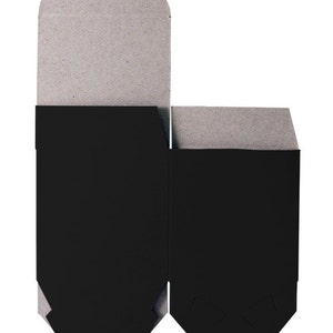May include: Two cardboard boxes with black interiors. The boxes are open and the interiors are visible. The boxes are made of a light brown cardboard.