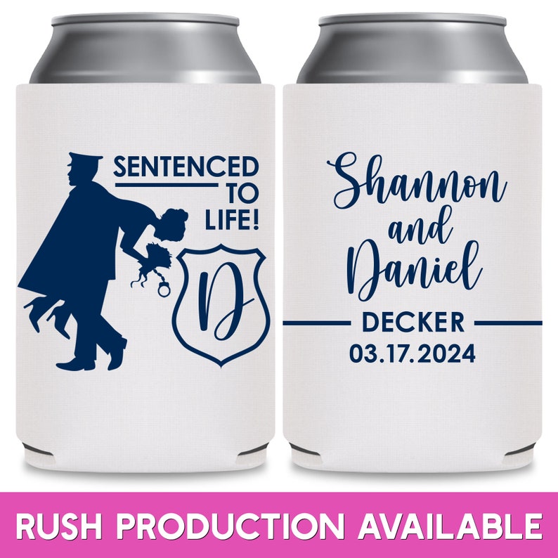 May include: Two white can coolers with blue text and graphics. The left cooler has a silhouette of a police officer carrying a woman over his shoulder. The text reads 'Sentenced to Life!' and 'D'. The right cooler has the text 'Shannon and Daniel Decker 03.17.2024'. Both coolers are for wedding favors.