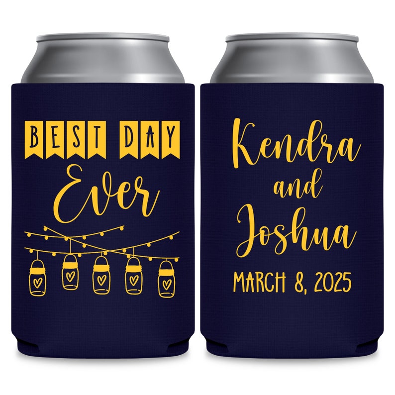 May include: Two navy blue can coolers with yellow text. The left cooler says 'Best Day Ever' with string lights and mason jars with hearts. The right cooler says 'Kendra and Joshua March 8, 2025'.