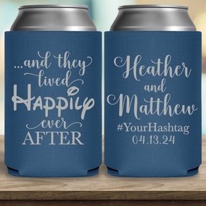 May include: Two blue can coolers with white text. The left cooler says '...and they lived happily ever AFTER'. The right cooler says 'Heather and Matthew #YourHashtag 04.13.24'.