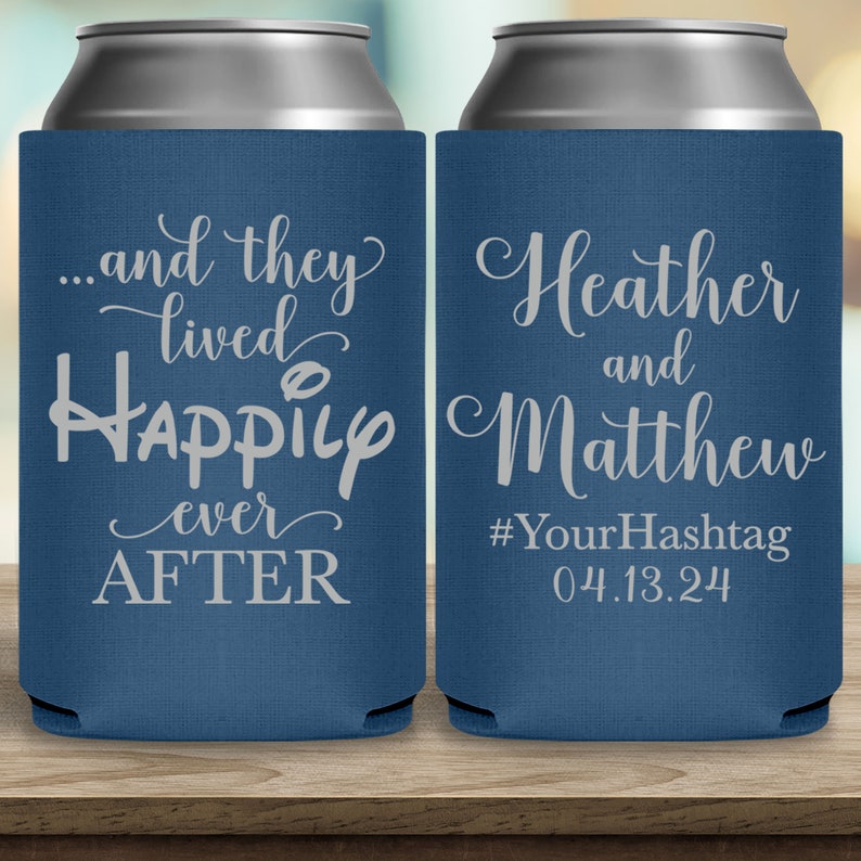 May include: Two blue can coolers with white text. The left cooler says '...and they lived happily ever AFTER'. The right cooler says 'Heather and Matthew #YourHashtag 04.13.24'.