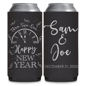 May include: Two black and silver can coolers. The left cooler has a clock face with the words 'Three...Two...One...' and 'Happy New Year' with silver glitter lettering. The right cooler has the words 'Sam & Joe' and 'December 31, 2023' in silver glitter lettering.