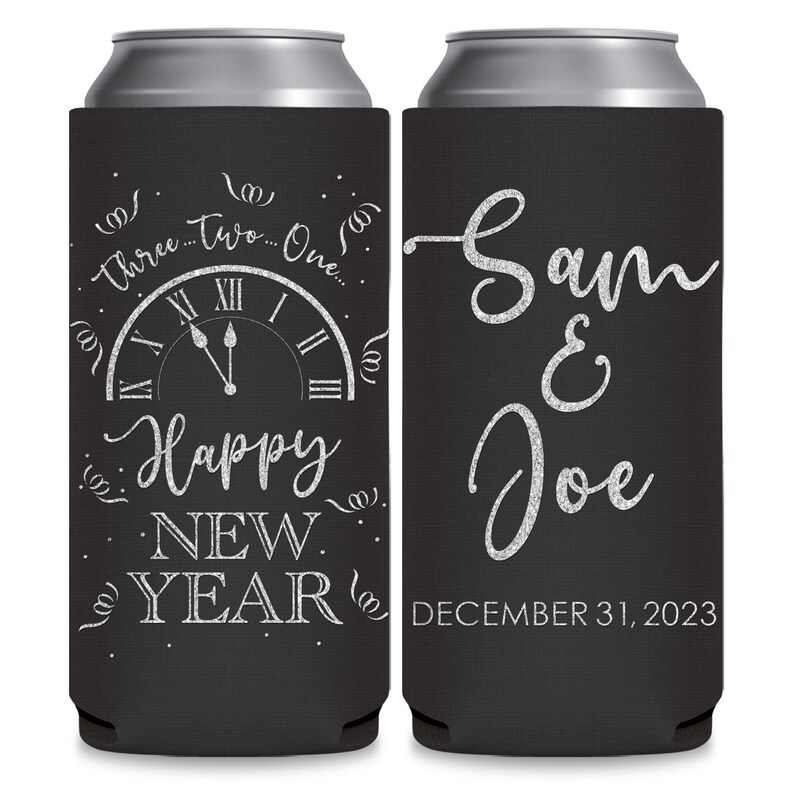 May include: Two black and silver can coolers. The left cooler has a clock face with the words 'Three...Two...One...' and 'Happy New Year' with silver glitter lettering. The right cooler has the words 'Sam & Joe' and 'December 31, 2023' in silver glitter lettering.