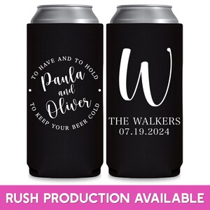 May include: Two black can coolers with white text. The cooler on the left has the text 'To have and to hold Paula and Oliver to keep your beer cold.' The cooler on the right has the text 'W The Walkers 07.19.2024.'