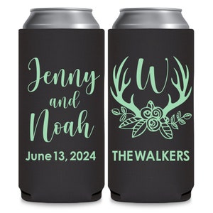 May include: Two black and green can coolers. One cooler has the text 'Jenny and Noah June 13, 2024' and the other cooler has the text 'JW THE WALKERS' with a floral design and antlers.