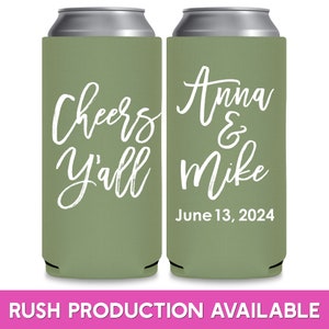 May include: Two green can coolers with white text. The left cooler says 'Cheers Y'all'. The right cooler says 'Anna & Mike' and 'June 13, 2024'.