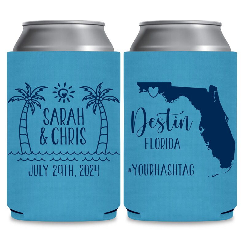 May include: Two blue and white can coolers. The cooler on the left has a palm tree design, a sun, and the text 'Sarah & Chris' and 'July 29th, 2024'. The cooler on the right has an outline of the state of Florida with a heart over the state of Florida and the text 'Destin Florida' and '#YOURHASHTAG'.