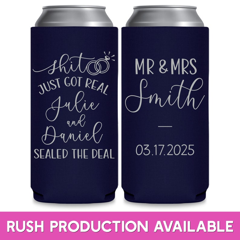 May include: Two navy blue can coolers with white text. The left cooler says 'shit just got real Julie and Daniel sealed the deal' with two rings and a diamond. The right cooler says 'MR & MRS Smith 03.17.2025'.