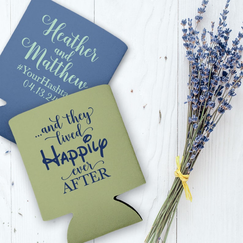 May include: Two koozies, one blue and one green. The blue koozie has the text 'Heather and Matthew #YourHashtag 04.13.24' on it. The green koozie has the text '...and they lived happily ever after' on it.