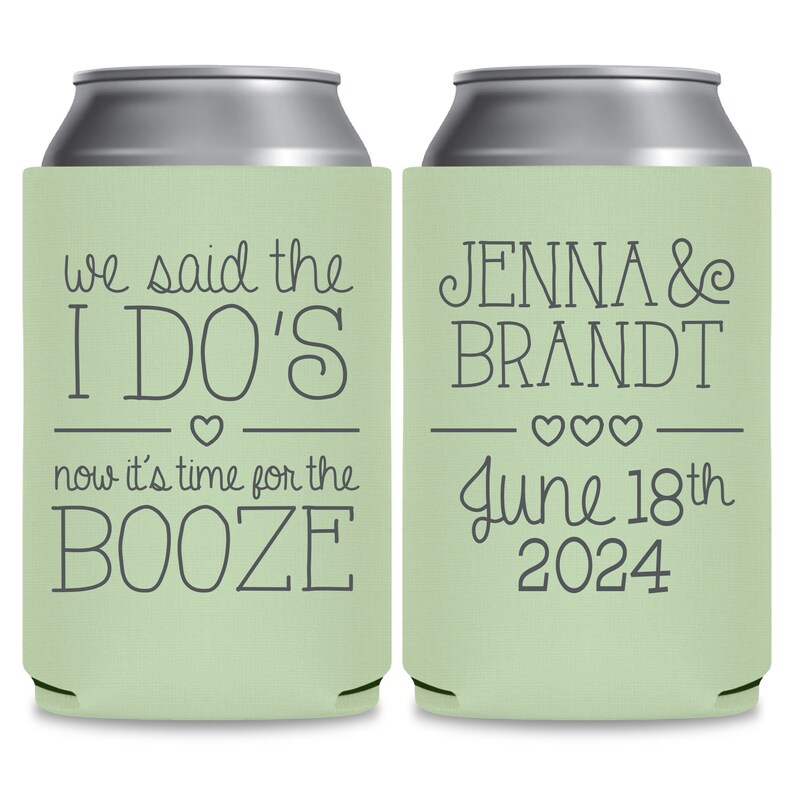 May include: Two green and silver can coolers. The left cooler has the text 'we said the I DO'S now it's time for the BOOZE' with a heart symbol. The right cooler has the text 'JENNA & BRANDT June 18th 2024' with three heart symbols.