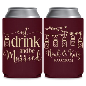 May include: Two maroon can coolers with a white and gold design. The left cooler has the text 'eat drink and be married' with a small jar with a heart on it. The right cooler has a string of lights with jars with hearts on them and the text 'Noah & Katy 10.07.2024'.