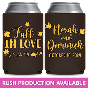 May include: Two brown and black can coolers with yellow text and leaf designs. The left cooler says 'Fall in Love' with a vine design. The right cooler says 'Norah and Dominick' with the date 'October 10, 2024'.