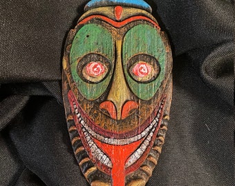 Tiki Mask Magnet with faces inspired by Trader Sam's Grog Grotto