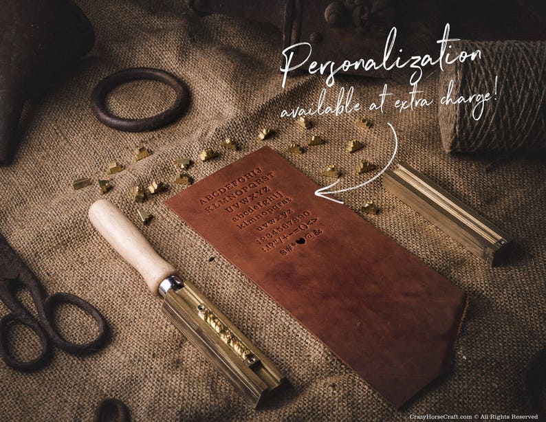 May include: A brown leather journal with a brass tool and a set of brass letter stamps. The journal has the alphabet printed on the cover. The text "Personalization available at extra charge!" is written on a white background.