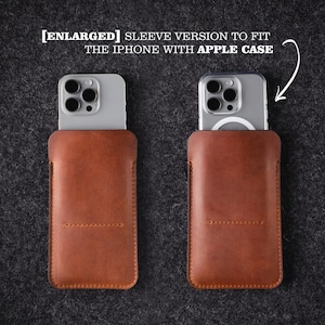 May include: Two brown leather phone sleeves, one with a silver iPhone with a clear case inside, and the other with a silver iPhone with a clear case and a white ring light inside. The text [ENLARGED] SLEEVE VERSION TO FIT THE IPHONE WITH APPLE CASE is at the top of the image.
