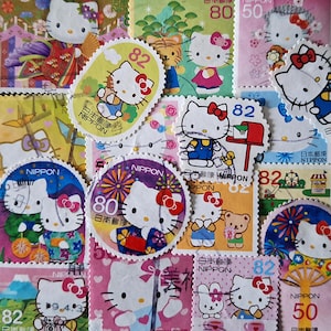SPEDIZIONE GRATUITA; 25 francobolli giapponesi/nipponici colorati HELLO Kitty da collezionare, creare, creare pagine di album ecc.