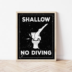 May include: A black and white sign with a distressed look that says "SHALLOW NO DIVING" with a graphic of a person diving headfirst into a toilet.