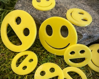 Geocache found it swag smile tokens!  Set of mixed sizes between the size of a quarter & a half dollar an original by tamis2go