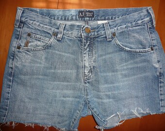 May include: Light blue denim shorts with frayed edges and a small Armani Jeans logo on the back waistband.