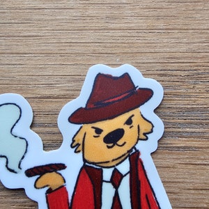 May include: A cartoon illustration of a dog wearing a red suit, a fedora hat, and holding a cigar. The dog has a serious expression on its face.