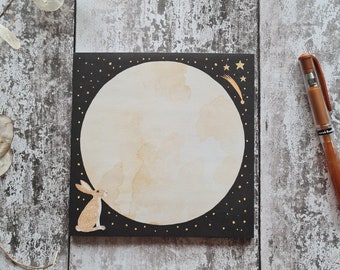 Square notepad 14.8cm x 14.8cm. Moon gazing hare with stars. Bedside or desk pad.