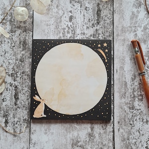 Square notepad 14.8cm x 14.8cm. Moon gazing hare with stars. Bedside or desk pad.