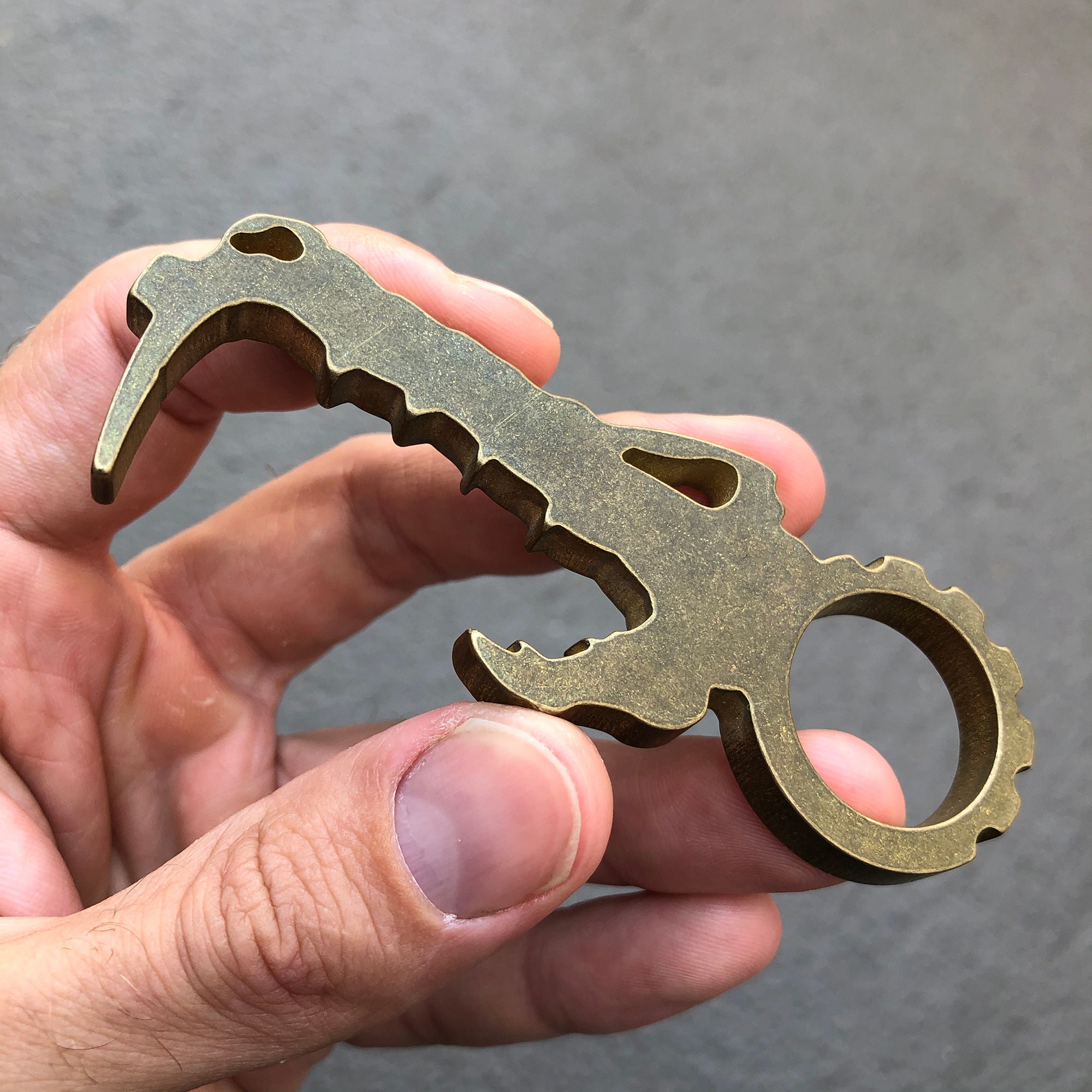 Dino-Phobe pocket tool, brass opener, made in the USA